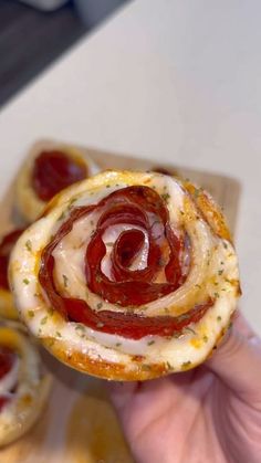 someone is holding up some food in their hand