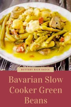 a white plate topped with green beans covered in sauce