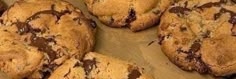 chocolate chip cookies on a wooden cutting board