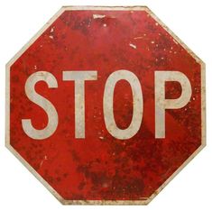 a red stop sign with white writing on it's bottom and the word stop written below