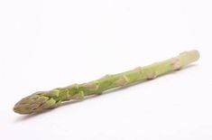 an asparagus stem on a white background