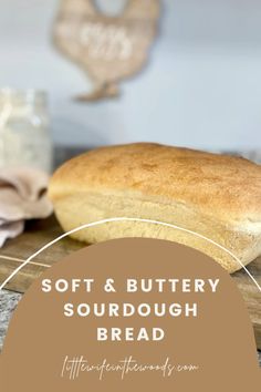 a loaf of sourdough bread sitting on top of a wooden cutting board with the words soft & buttery sourdough bread