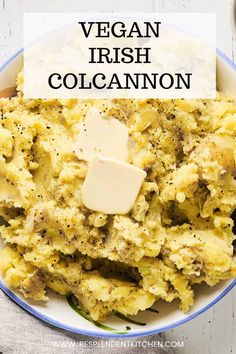 a bowl filled with mashed potatoes topped with butter and parmesan cheese text reads vegan irish colcannon