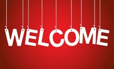 the word welcome hanging from strings on a red background with white letters that spell out