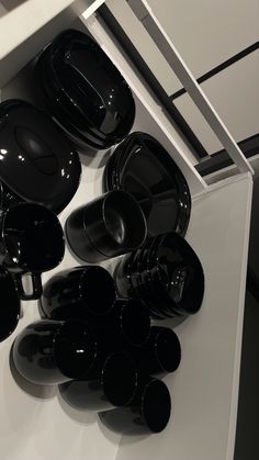 black dishes are stacked on top of each other