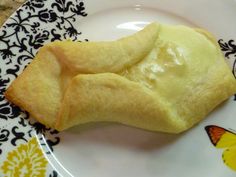 some kind of pastry on a plate with butterfly designs