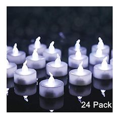 many lit candles sitting on top of each other in front of a black background with the words 24 pack