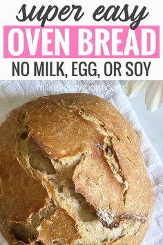 a loaf of bread sitting on top of a white towel with text overlay that reads super easy oven - made oven bread no milk, egg or soy