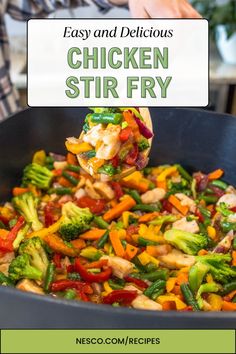 chicken stir fry with broccoli, carrots and peppers in a skillet