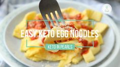 an egg noodle dish with ketchup and parmesan cheese on it
