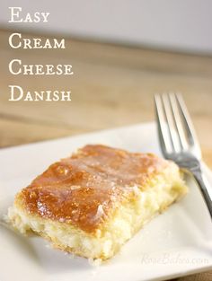 a piece of cheese danish on a white plate with a fork next to it and the words, easy cream cheese danish