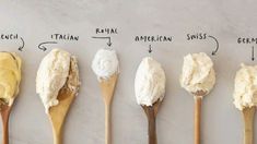 six wooden spoons with different types of whipped cream on them, all labeled in the same language