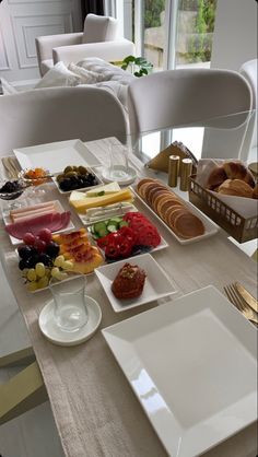 the table is set with many different types of food