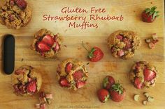 several strawberry rhubarb muffins on a cutting board