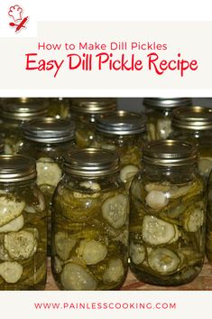 jars filled with pickles sitting on top of a table