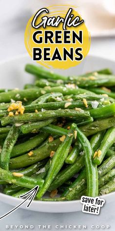green beans in a white bowl with garlic on top and the words garlic green beans above it
