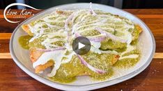 a white plate topped with food on top of a wooden table