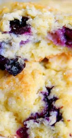 two blueberry muffins stacked on top of each other