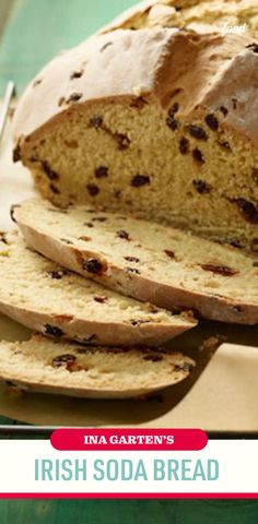 a loaf of irish soda bread on a cutting board with slices cut out and the words ina garton's irish soda bread