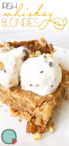 a piece of cake with ice cream on top and nuts in the middle, sitting on a white plate