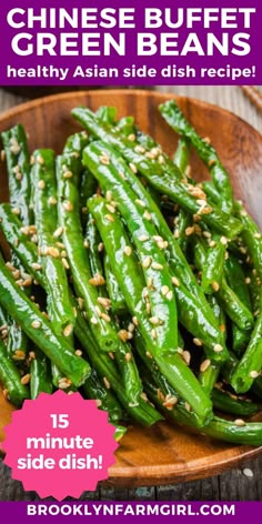 a bowl full of green beans with an Asian sauce and sesame seeds