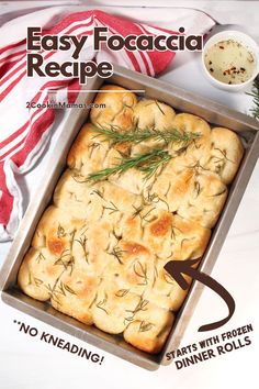 an easy focaccia recipe in a baking pan with rosemary sprigs