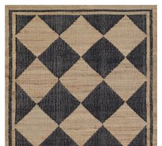 an area rug with black and white squares on it