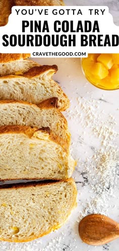 a close up of bread on a white surface with text overlay reading you've gota try pina cola sourdough bread