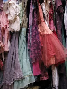 Pile Of Vintage Clothes, Pile Of Colorful Clothes, Vintage Clothing Pile, Costume Shop Aesthetic, Pile Of Dresses, Pile Of Old Clothes, Clothing Pile, Pile Of Assorted Clothing, Disorganized Clothing Pile