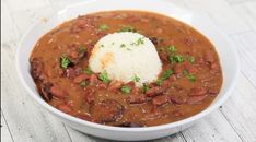 a white bowl filled with beans and rice