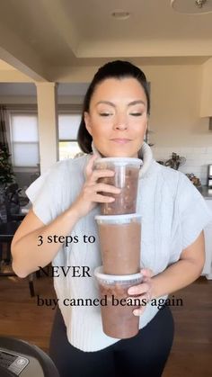 a woman holding a blender in her hands with the words 3 steps to never buy canned beans again