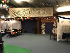 a man standing in front of a sign that says happy birthday nieo baccina