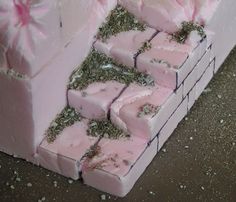 there is a cake made to look like it has pink frosting and sprinkles