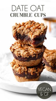 three desserts stacked on top of each other in front of a cup of coffee