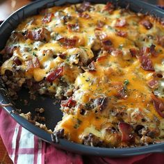 a casserole dish with meat and cheese on it