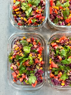 four glass containers filled with different types of salads