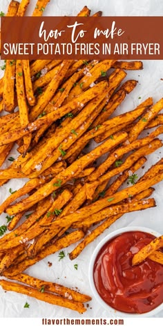 sweet potato fries in air fryer with ketchup and sauce on the side