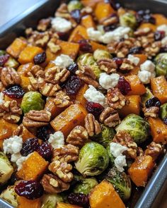 brussel sprouts, brussels sprouts, and cranberries in a pan