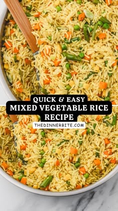 a bowl filled with rice and vegetables next to a wooden spoon