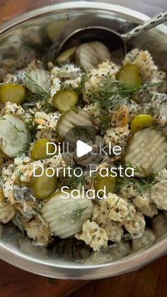 a bowl filled with lots of food on top of a wooden table