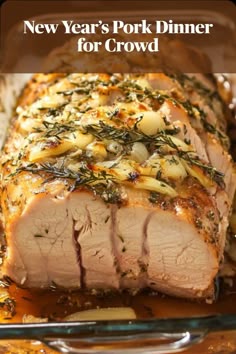 A beautifully roasted pork loin garnished with rosemary, an elegant New Year’s Eve dinner idea for a crowd.