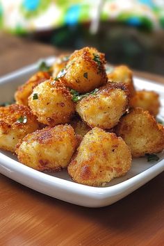 some fried food is on a white plate