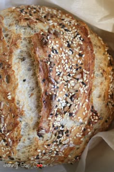 a close up of a loaf of bread with sesame seeds