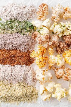 different types of popcorn on top of each other with seasoning and spices in them