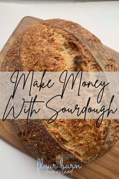 a loaf of sourdough sitting on top of a cutting board with the words make money with sourdough