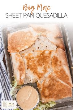 a pan filled with quesadillas and sauce