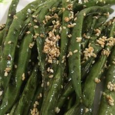 green beans with sesame seeds and seasoning on top