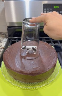 a cake with a dog figurine on top of it