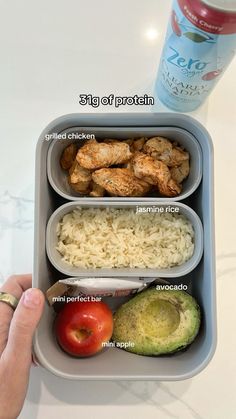 a person holding a container with food in it