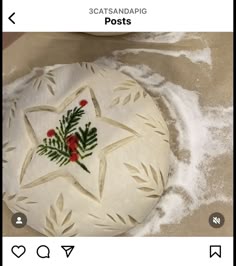 a star shaped cake sitting on top of a table covered in frosted icing